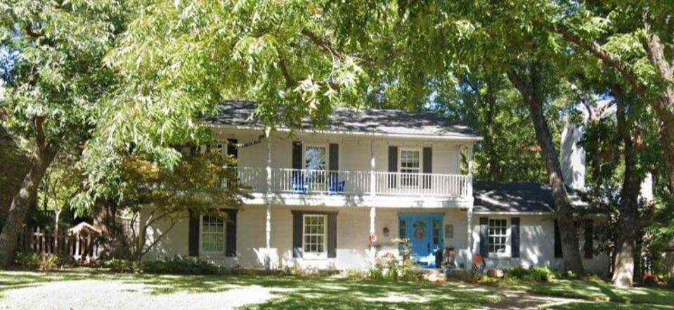 Finished exterior painting for a white house